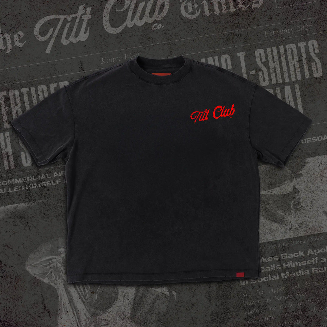 A controversial and statement-making tee featuring a newspaper-style graphic of media headlines, with bold red graffiti-style text overlaying the design, creating a rebellious and thought-provoking aesthetic.